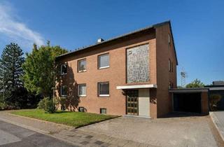 Mehrfamilienhaus kaufen in 41569 Rommerskirchen, Rommerskirchen - Mehrfamilienhaus mit großem Garten, Garage und Gewerbeeinheit