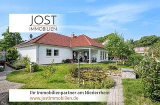 Haus kaufen in 41238 Mönchengladbach, Mönchengladbach - Zukunftssicher wohnen: Energieeffizienter Bungalow mit sonnigem Garten und vielen Extras.