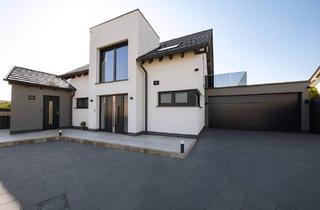 Einfamilienhaus kaufen in 52388 Nörvenich, Nörvenich - Familienidyll am Feldrand: KfW-40+ Traumhaus mit großem Südwest-Garten und Einliegerwohnung