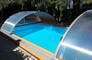 Einfamilienhaus kaufen in 61184 Karben, Karben - Freistehendes Einfamilienhaus mit Pool, Garten & Garage in Karben