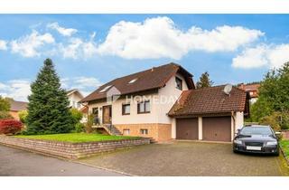 Haus kaufen in 36167 Nüsttal, Familienfreundliches EFH mit großem Garten, Terrasse, EBK und Garagen in ruhiger Lage