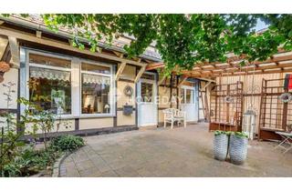 Haus kaufen in 37627 Stadtoldendorf, Stadtoldendorf - Liebevoll saniertes Fachwerkhaus - ideal als Wohn- und Geschäftshaus mit Garagen und Hof