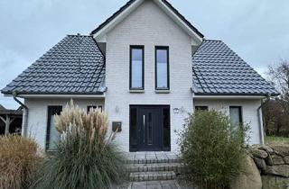 Einfamilienhaus kaufen in 25881 Tating, Charmantes Einfamilienhaus mit Einliegerwohnung, Fußbodenheizung und großem Garten