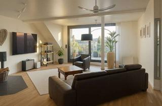 Wohnung kaufen in 40545 Oberkassel, Vermietete 2-Zimmer-Dachgeschosswohnung mit Balkon, Kamin & Klimaanlage