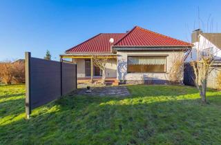 Haus kaufen in 24806 Hohn, Winkelbungalow mit Ausbaureserve, Keller und Garage in ruhiger, familiengerechter Lage von Hohn