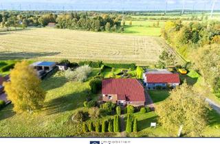 Haus kaufen in 26556 Westerholt, Gepflegtes Wohnhaus mit Praxis und Baugrundstück!