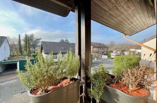 Wohnung kaufen in 55294 Bodenheim, Lichtdurchflutete Etagenwohnung mit Balkon und Charakter eines Hauses - kleine Einheit, ruhige Lage