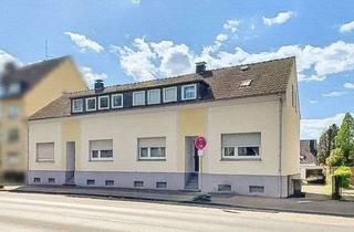 Doppelhaushälfte kaufen in 45357 Dellwig, Zwei vermietete Doppelhaushälften mit Garagenhof und Garten in Essen-Dellwig – Potential für mehr