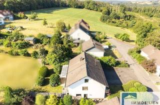 Haus kaufen in 57614 Niederwambach, Großzügiges Zweifamilienhaus mit separater Garage in ruhiger Ortsrandlage!