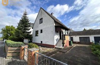 Einfamilienhaus kaufen in 63110 Rodgau, * Sanierungsbedürftig * Freistehendes Einfamilienhaus auf geteiltem Grundstück in Rodgau-Rollwald