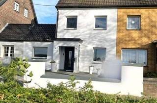 Doppelhaushälfte kaufen in 41379 Brüggen, BRÜGGEN-BRACHT - Modernisierte Doppelhaushälfte mit Innenhof, Terrasse, Garten, Garage