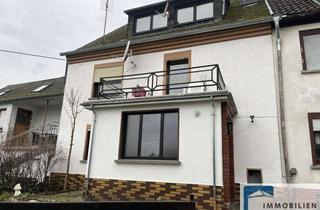 Anlageobjekt in 53547 Hümmerich, Vermietetes Reihenmittelhaus mit kleinem Nebengebäude in Hümmerich!