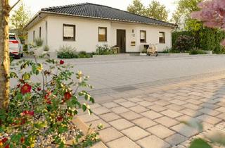 Haus kaufen in 34630 Gilserberg, Gilserberg - Der Bungalow mit der charmanten Form in Gilserberg OT Sebbeterode - ausgefallen und praktisch