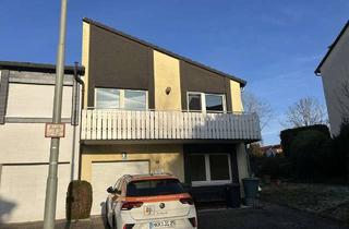 Haus kaufen in 61130 Nidderau, Attraktives Wohnhaus mit Balkon und Garage in familienfreundlicher Umgebung