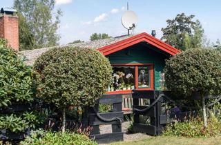 Haus kaufen in 24860 Böklund, Landromantik am Langsee -Gemütliches Ferien-Blockhaus in blühender Idylle
