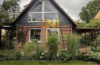 Doppelhaushälfte kaufen in 38110 Wenden, Wohlfühl-Oase in Harxbüttel: Doppelhaushälfte mit Kamin, Teich & überdachter Terrasse