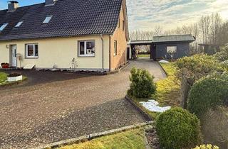 Doppelhaushälfte kaufen in 24644 Timmaspe, Vermietete Doppelhaushälfte und Baugenehmigung für ein EFH