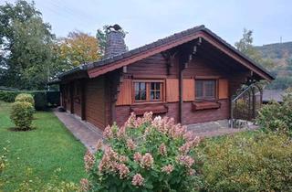 Haus kaufen in 57632 Flammersfeld, Flammersfeld - Gemütliches Holzblockhaus mit schönem Garten