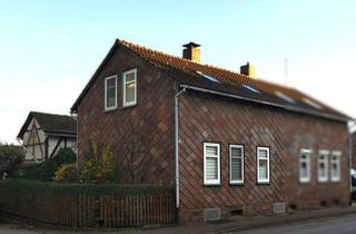 Doppelhaushälfte kaufen in 37603 Holzminden, Charme der Geschichte: Doppelhaushälfte mit Garten und Modernisierungspotenzial in Holzminden