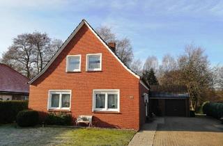 Einfamilienhaus kaufen in 26810 Westoverledingen, Westoverledingen - Einfamilienhaus mit Garage und freiem Blick auf Grünfläche