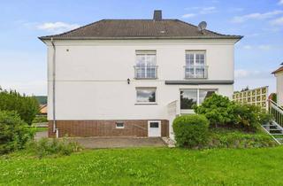 Haus kaufen in 36284 Hohenroda, Zweifamilienhaus mit 2. Garagen und schön gelegenem Garten!