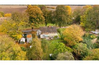 Haus kaufen in 18249 Warnow, Charmantes EFH mit großem Grundstück, Nebengebäuden und idyllischer Lage in Warnow OT Schlockow