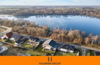 Einfamilienhaus kaufen in 26899 Rhede, Exklusives Wohnen am Wasser – modernes Einfamilienhaus mit Seelage & Top Energieeffizienz