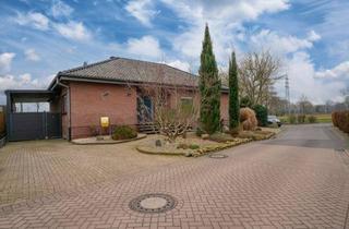 Haus kaufen in 46446 Emmerich, Hüthum: Leben auf einer Ebene mit Untergeschoss, Garage, Großes Carport
