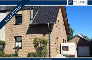 Doppelhaushälfte kaufen in 53879 Euskirchen, Charmante Doppelhaushälfte mit Familiengarten und vielseitigem, großem Garagenhaus in Euskirchen