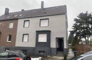 Doppelhaushälfte kaufen in 59229 Ahlen, Ahlen - Zweifamilienhaus im Ahlener Osten mit zusätzlicher Baumöglichkeit