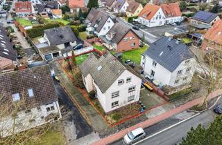 Grundstück zu kaufen in 33330 Gütersloh, Bebautes Grundstück mit genehmigter Planung für ein Sechsparteienhaus mit geförderten Wohnungen i