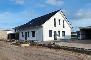 Haus kaufen in 49685 Emstek, Emstek - Zuverlässig vermietetes modernes Zweifamilienhaus in top Lage