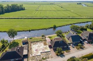 Grundstück zu kaufen in 26759 Hinte, Wohnen am Wasser – Grundstück mit Bauoption in idyllischer Lage