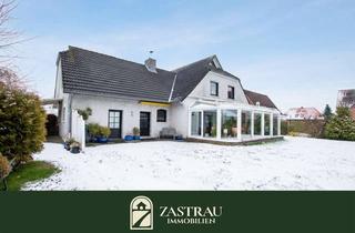 Einfamilienhaus kaufen in 26624 Südbrookmerland, Wohnen, wo die Ruhe zuhause ist – Einfamilienhaus mit Wintergarten in Ostfriesland