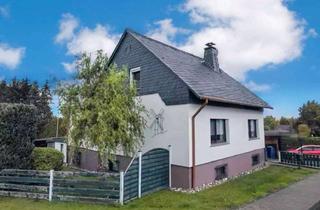 Einfamilienhaus kaufen in 56593 Horhausen, Einfamilienhaus bei Horhausen mit stabilen Mieteinnahmen und weitläufigem Grundstück