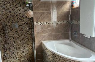 Mehrfamilienhaus kaufen in 71120 Grafenau, Grafenau - Großzügige 4-Zimmer-EG-Wohnung mit Terrasse, Balkon, Garage