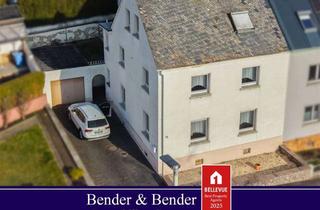 Haus kaufen in 65604 Elz, Solides Zweifamilienhaus mit Garagen und Garten -ideal für Generationenwohnen in Elz!