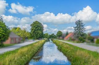 Immobilie kaufen in 26629 Großefehn, Kanallage in Spetzerfehn: 2.700 m² großes, parkähnliches Grundstück mit Abrisshaus!