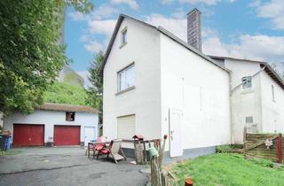 Haus kaufen in 35753 Greifenstein, Wohnen unterhalb der Burg - mit Garten, 2 Garagen und weiteren Stellplätzen