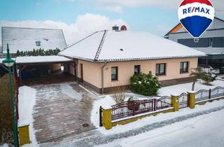 Haus kaufen in 39218 Schönebeck, Wohnglück auf einer Ebene – Winkelbungalow mit Südterrasse und Kamin