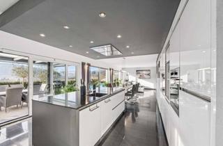 Haus kaufen in 63773 Goldbach, Durchdachtes Wohnkunstwerk mit Gartenoase – Exklusiver Bungalow in Goldbach-Unterafferbach