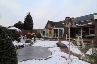 Haus kaufen in 26810 Westoverledingen, Großes Wohnhaus mit ca. 75m² Wintergarten inkl. Schwimmbad mit zwei Garagen und vielen Extras!