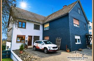 Haus kaufen in 57629 Heimborn, von RTI: Zwei Einfamilienhäuser im Doppelhausstil mit drei Garagen in Heimborn zum Preis von einem