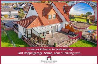 Haus kaufen in 34266 Niestetal, Ein echtes Platzwunder für die ganze Familie mit Blick in's Grüne!