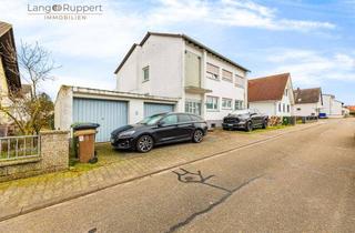 Haus kaufen in 68647 Biblis, Vermietetes, teilmodernisiertes Zweifamilienhaus mit Garten