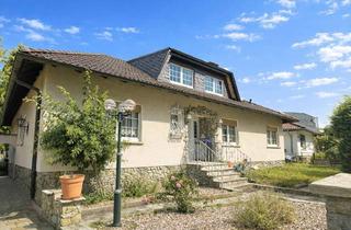 Einfamilienhaus kaufen in 61197 Florstadt, Einfamilienhaus im Bungalowstil mit großem Garten und Terrasse