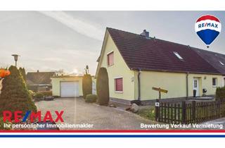 Doppelhaushälfte kaufen in 24537 Neumünster, Modernisierte Doppelhaushälfte mit PV-Anlage in der Bogenstraße