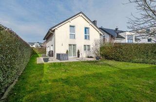 Einfamilienhaus kaufen in 61250 Usingen, Usingen - Familienfreundliches, energieeffizientes Wohnen in Usingen mit moderner EBK, Garten und 2 Stellpl.