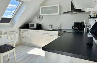 Anlageobjekt in 23669 Timmendorfer Strand, ++ FERIENWOHNUNG ALS ATTRAKTIVES INVESTMENT ++ DG-Wohnung mit Loggia und TG-Stellplatz.
