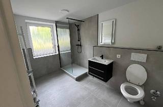 Wohnung kaufen in 66346 Püttlingen, Püttlingen - Kernsanierte Wohnung mit Garten & Einliegerwohnung